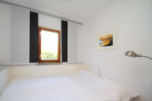 Schlafzimmer · Ferienhäuschen am Kapitänshaus im Ostseebad Wustrow auf dem Fischland Darss Zingst